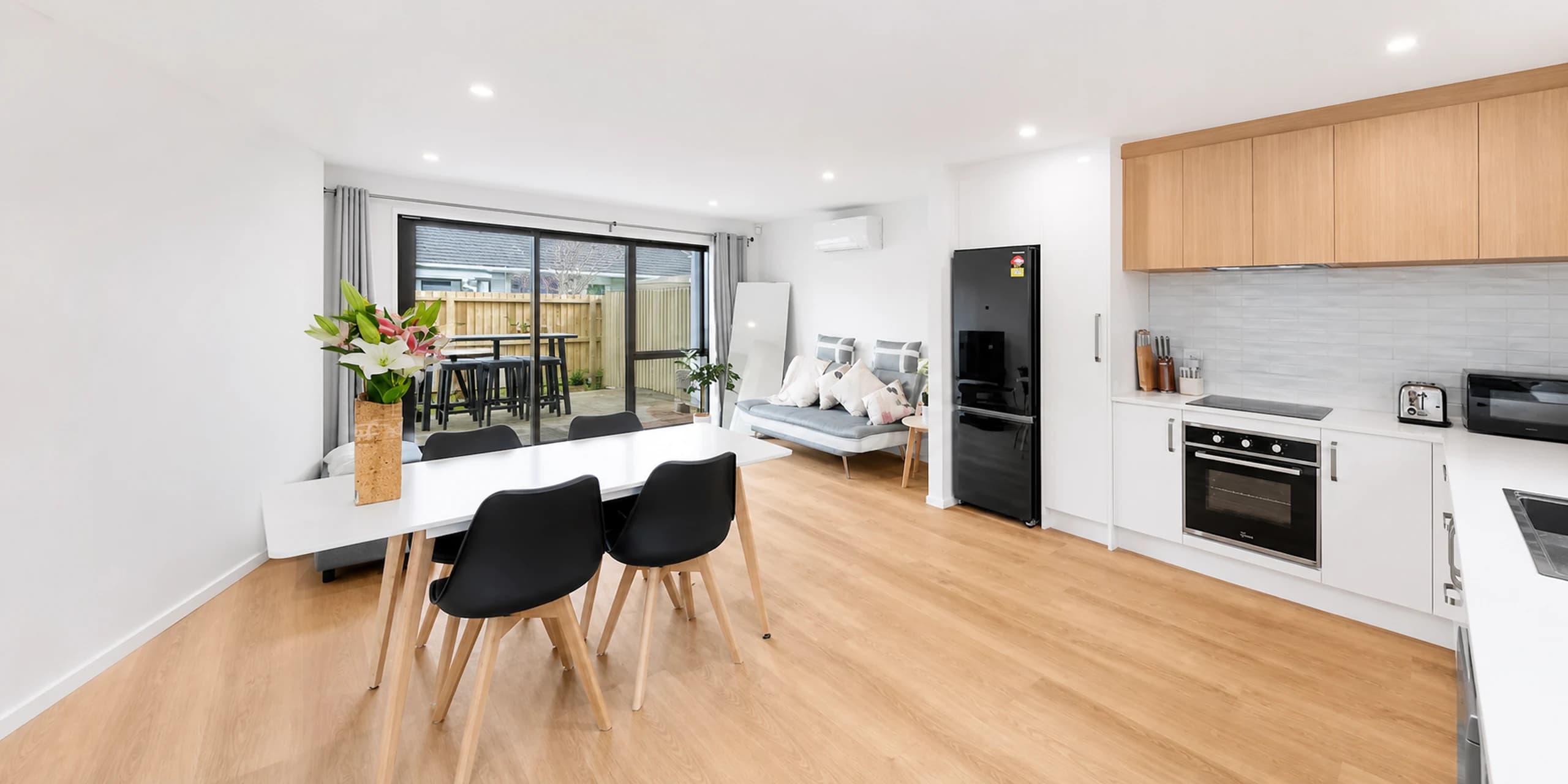 Modern furnished kitchen and dining area in Christchurch